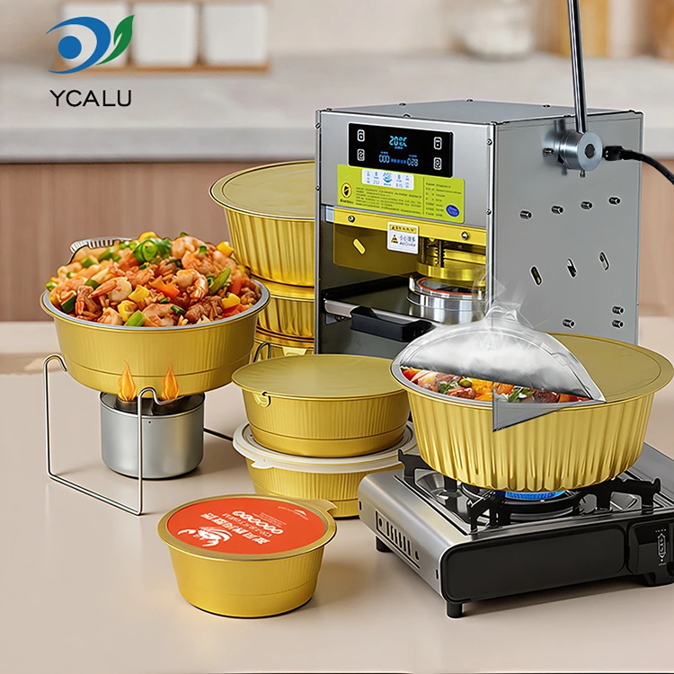 Rankinė šiluminio sandarinimo mašina su auksiniais aliuminio folijos konteineriais